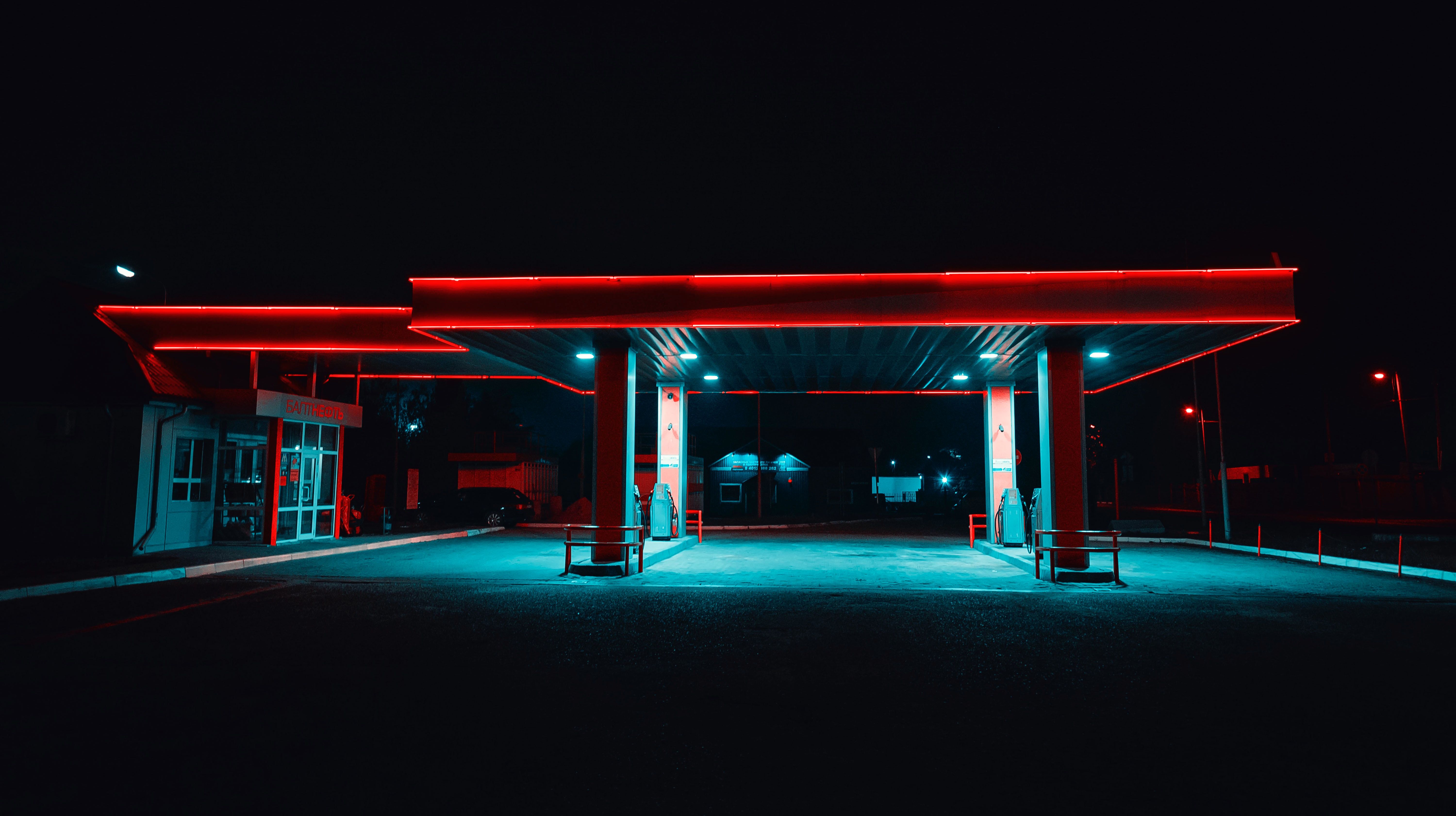 A gas station lit up at night.