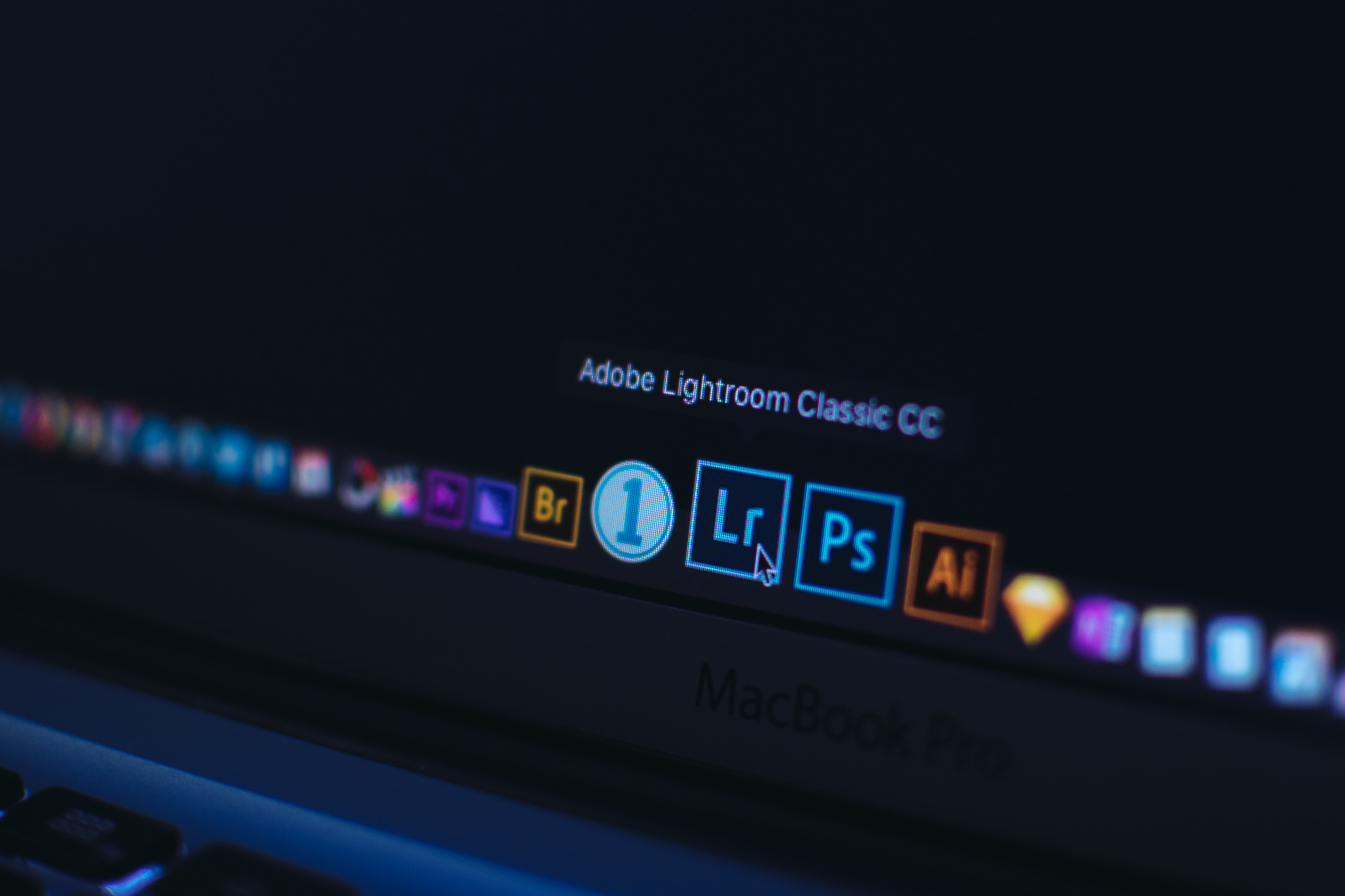 A computer screen with the mouse hovering over the Abobe Lightroom application.